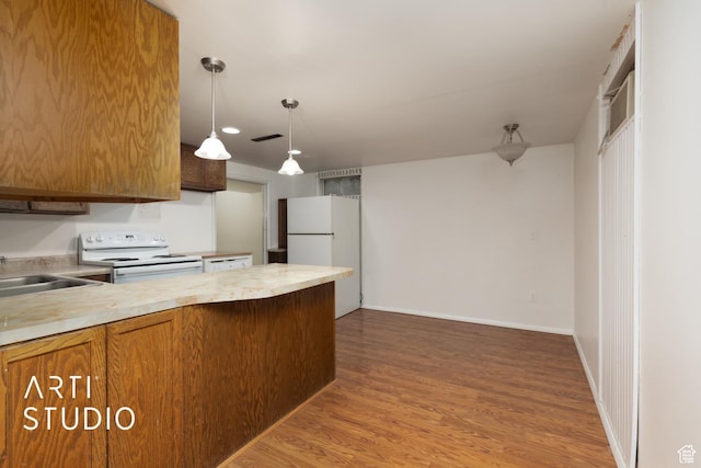 941 E Carnation Dr, Sandy, UT 84094 - kitchen with white appliances, brown cabinets, light countertops, and a sink