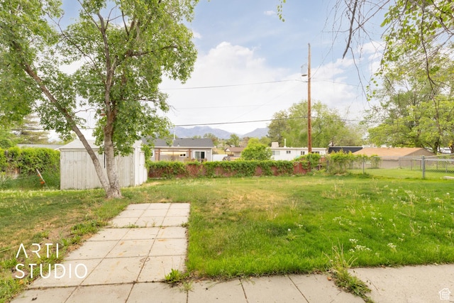 941 E Carnation Dr, Sandy, UT 84094 - view of yard with fence and a mountain view