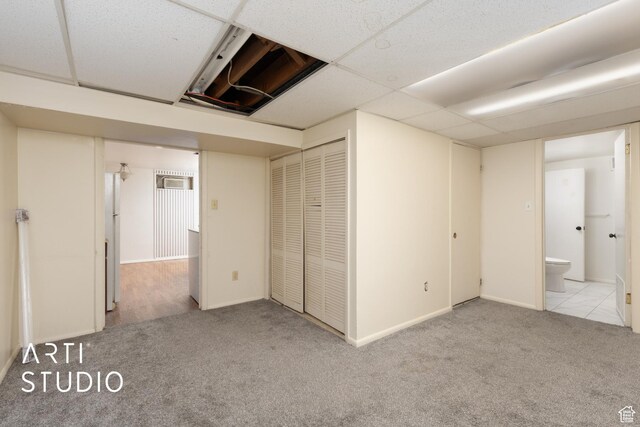 941 E Carnation Dr, Sandy, UT 84094 - unfurnished bedroom with carpet, a closet, a drop ceiling, and baseboards
