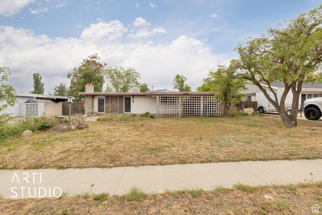 941 E Carnation Dr, Sandy, UT 84094 - view of front of home with a chimney