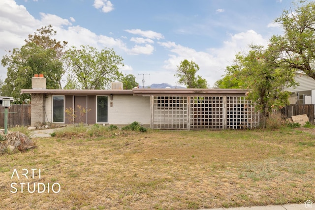 941 E Carnation Dr, Sandy, UT 84094 - rear view of property featuring a chimney
