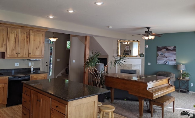 465 N 100th St E, Millville, UT 84326 - kitchen featuring black dishwasher, a ceiling fan, a fireplace, recessed lighting, and a center island