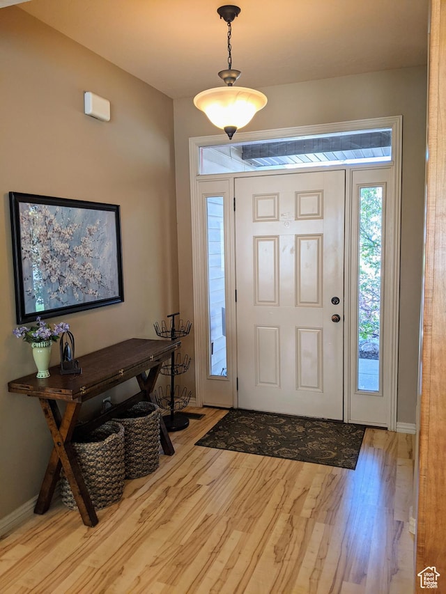 465 N 100th St E, Millville, UT 84326 - foyer entrance featuring wood finished floors and baseboards