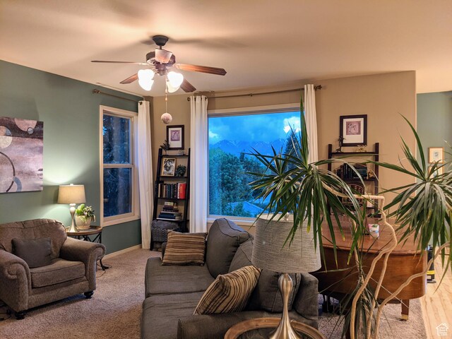 465 N 100th St E, Millville, UT 84326 - living room featuring ceiling fan, baseboards, and carpet flooring