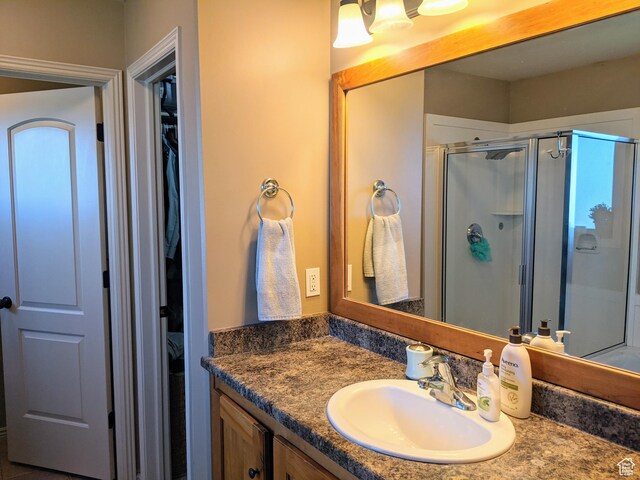 465 N 100th St E, Millville, UT 84326 - bathroom with a shower stall, vanity, and a spacious closet