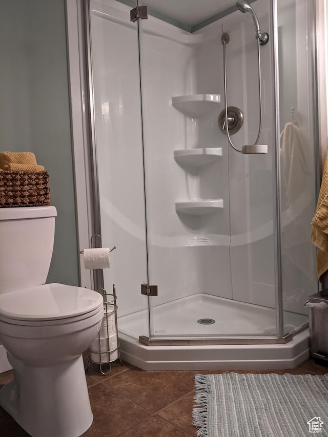 465 N 100th St E, Millville, UT 84326 - bathroom featuring a shower stall, toilet, and tile patterned flooring