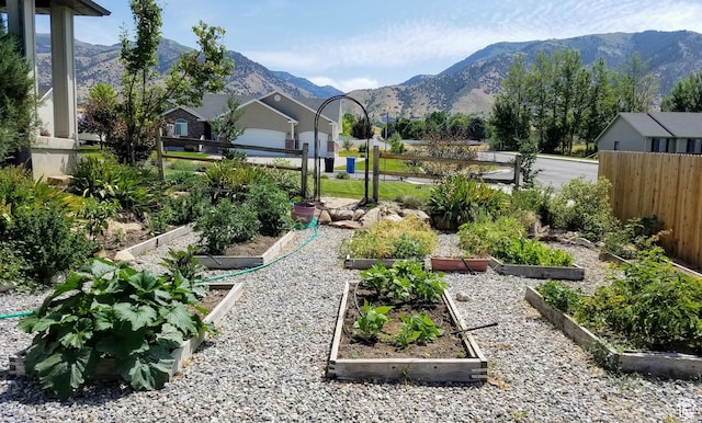 465 N 100th St E, Millville, UT 84326 - view of yard featuring a vegetable garden and a mountain view