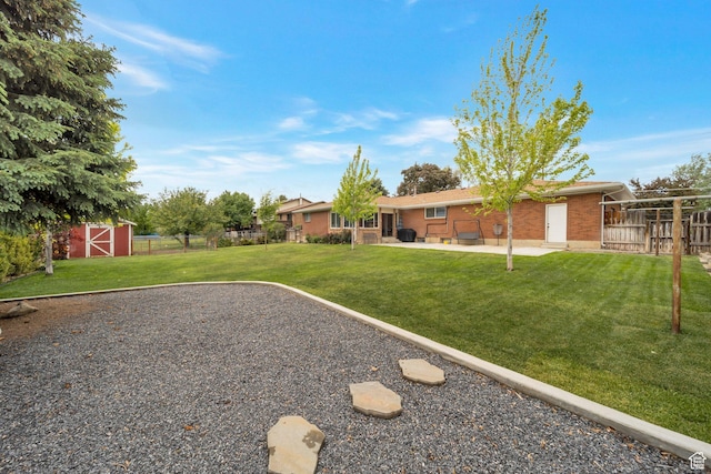 1885 W 300 N, West Point, UT 84015 - view of yard featuring a patio area and an outbuilding