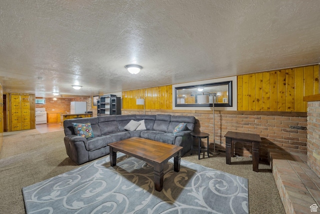 1885 W 300 N, West Point, UT 84015 - living room with carpet flooring, a textured ceiling, and wood walls