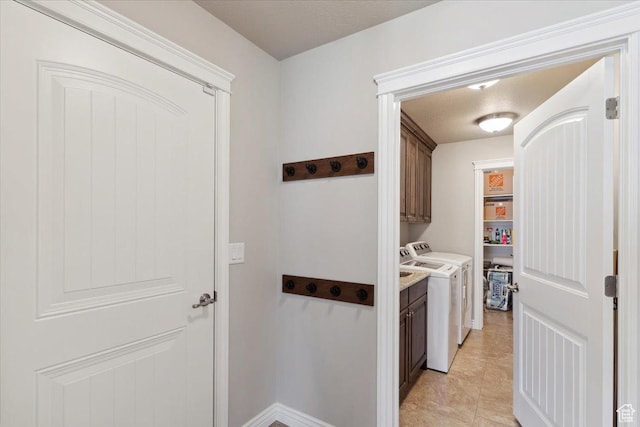 1776 W 3025 S, Syracuse, UT 84075 - laundry area with cabinet space, washer and clothes dryer, and light tile patterned flooring
