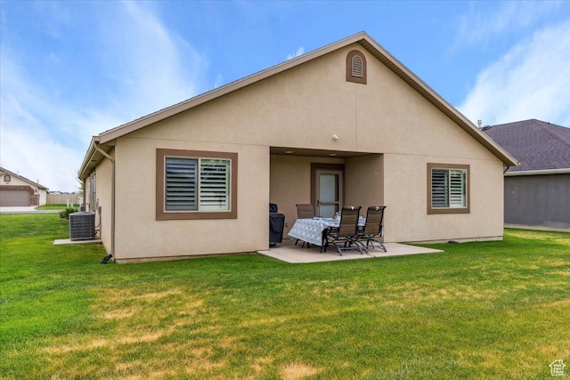 1776 W 3025 S, Syracuse, UT 84075 - back of house featuring central AC, a patio area, a yard, and stucco siding