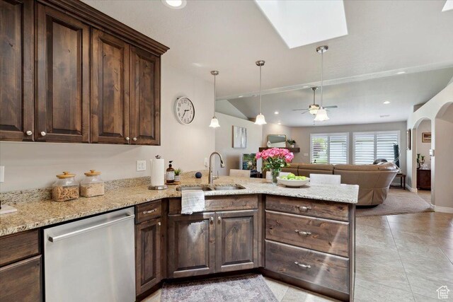 1776 W 3025 S, Syracuse, UT 84075 - kitchen with stainless steel dishwasher, a sink, a peninsula, dark brown cabinetry, and open floor plan
