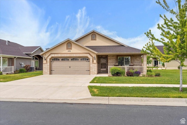 1776 W 3025 S, Syracuse, UT 84075 - view of front of property with brick siding, a garage, a front yard, concrete driveway, and stucco siding
