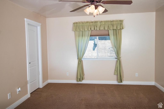 empty room featuring carpet floors, a ceiling fan, and baseboards
