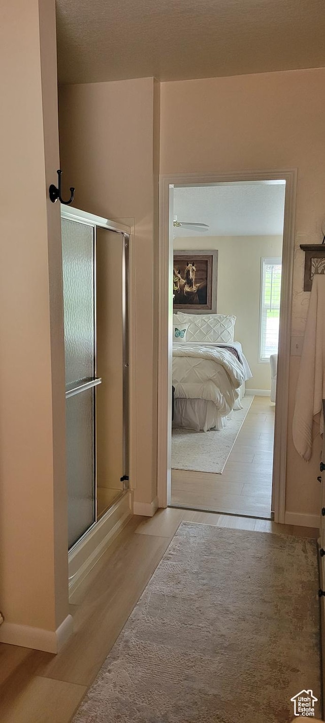 65 E 200 S, Orderville, UT 84758 - bathroom featuring wood finished floors, a shower stall, and baseboards