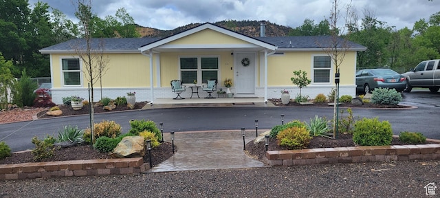 65 E 200 S, Orderville, UT 84758 - view of front facade featuring a porch, brick siding, and driveway