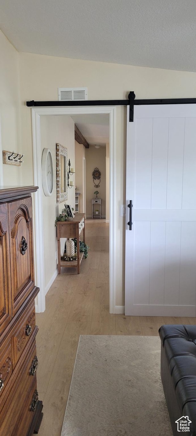 65 E 200 S, Orderville, UT 84758 - interior space with light wood finished floors, a barn door, and baseboards