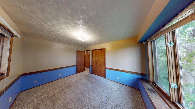 662 N 1600 E, Preston, ID 83263 - carpeted spare room with a textured ceiling and baseboards