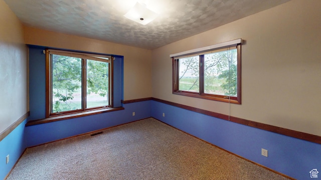 662 N 1600 E, Preston, ID 83263 - carpeted empty room featuring healthy amount of natural light, baseboards, and a textured ceiling