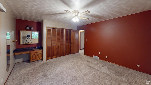 662 N 1600 E, Preston, ID 83263 - unfurnished bedroom with light carpet, multiple closets, a desk, and ceiling fan