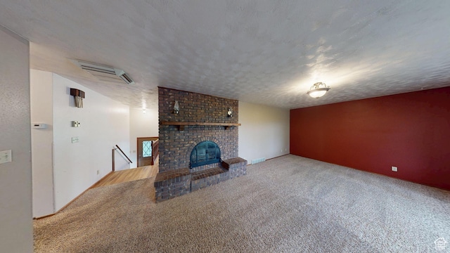 662 N 1600 E, Preston, ID 83263 - unfurnished living room featuring carpet floors and a brick fireplace