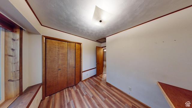 662 N 1600 E, Preston, ID 83263 - unfurnished bedroom featuring light wood-style floors, a closet, and baseboards