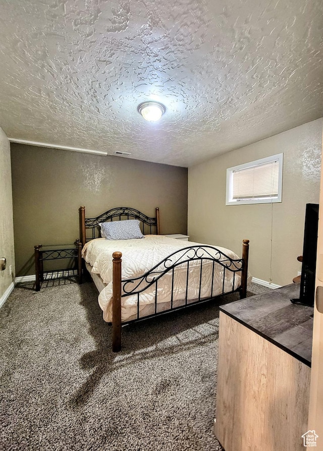273 S 700 W, Parowan, UT 84761 - carpeted bedroom with a textured ceiling, baseboards, and a textured wall