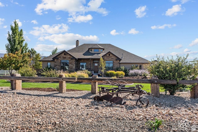 3437 W 1600 N, Cedar City, UT 84721 - view of front of house featuring a chimney, brick siding, a front lawn, and roof with shingles