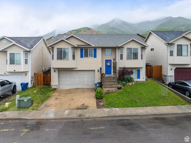 78 N Peach St E, Santaquin, UT 84655 - bi-level home featuring an attached garage, a mountain view, and driveway