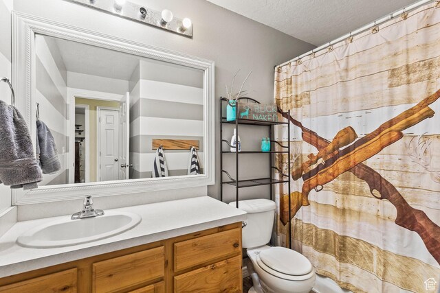 78 N Peach St E, Santaquin, UT 84655 - bathroom with vanity, toilet, a textured ceiling, and a shower with shower curtain