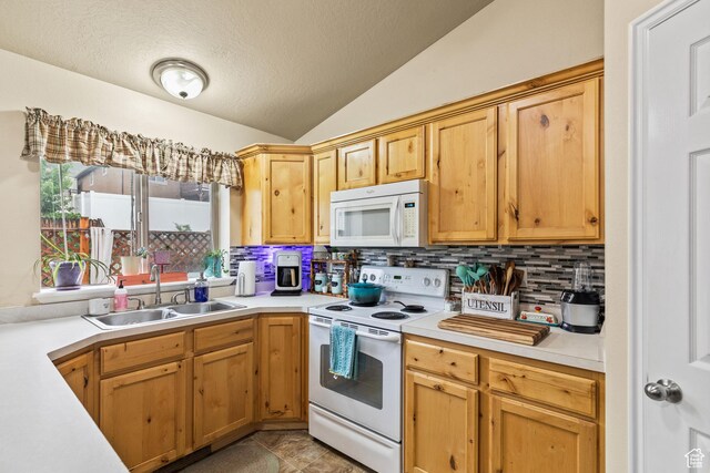 78 N Peach St E, Santaquin, UT 84655 - kitchen featuring white appliances, a sink, light countertops, tasteful backsplash, and vaulted ceiling