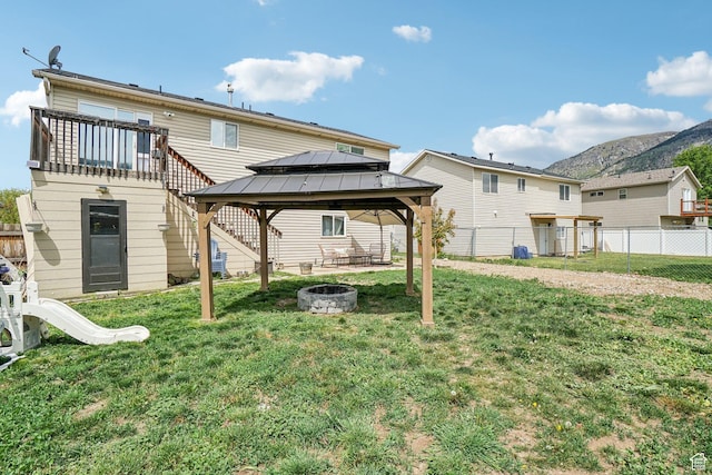 517 E Canyon View Dr N, Ogden, UT 84404 - rear view of house with an outdoor fire pit, a gazebo, and a mountain view