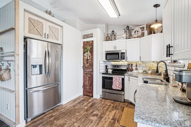 517 E Canyon View Dr N, Ogden, UT 84404 - kitchen with appliances with stainless steel finishes, a sink, dark wood-style floors, tasteful backsplash, and light stone counters