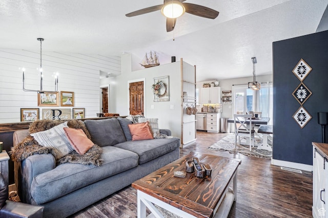 517 E Canyon View Dr N, Ogden, UT 84404 - living room featuring a chandelier, dark wood-style floors, a ceiling fan, a textured ceiling, and lofted ceiling