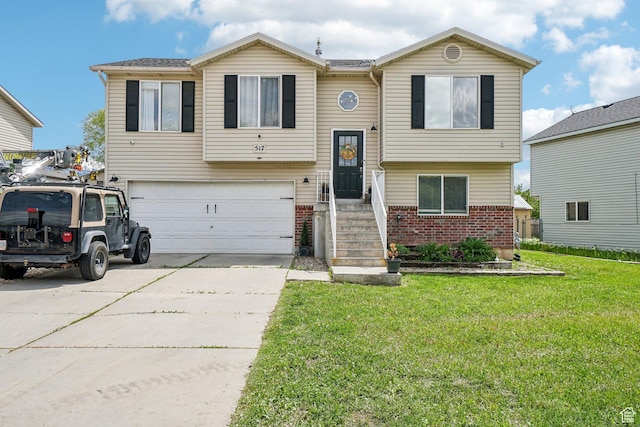 517 E Canyon View Dr N, Ogden, UT 84404 - raised ranch with brick siding, an attached garage, a front yard, and driveway