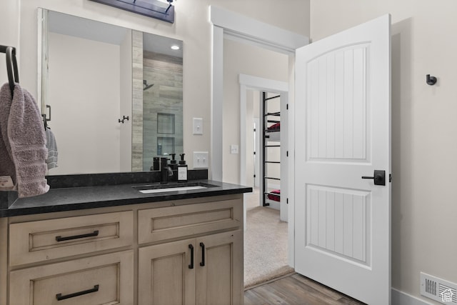 22 Old Ranch Rd, Montpelier, ID 83254 - full bath featuring a stall shower, vanity, and wood finished floors