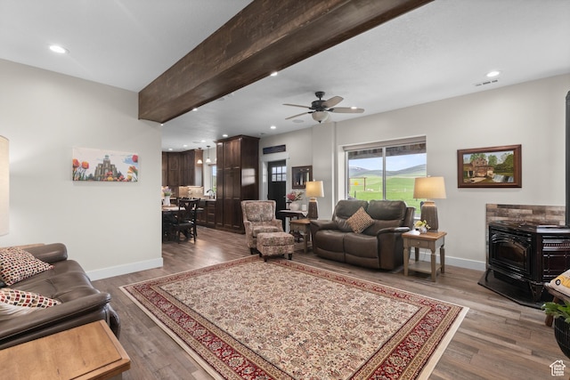 22 Old Ranch Rd, Montpelier, ID 83254 - living area featuring a wood stove, baseboards, wood finished floors, and recessed lighting