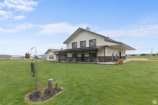22 Old Ranch Rd, Montpelier, ID 83254 - back of house featuring a patio area, a chimney, and a lawn