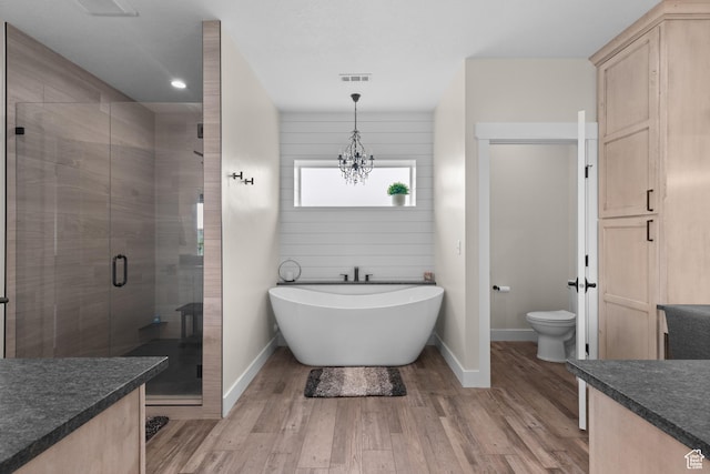 22 Old Ranch Rd, Montpelier, ID 83254 - full bath with a shower stall, baseboards, toilet, vanity, and a soaking tub