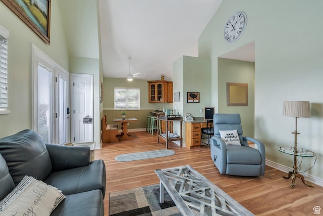 861 N 1100 E, Pleasant Grove, UT 84062 - living area featuring high vaulted ceiling, light wood-style flooring, baseboards, and a ceiling fan