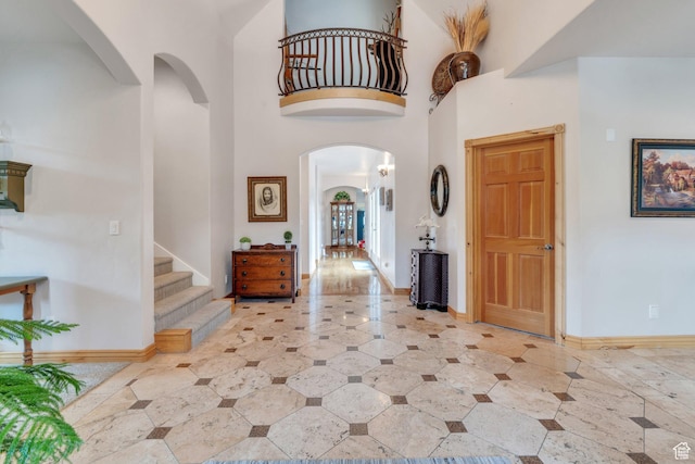 861 N 1100 E, Pleasant Grove, UT 84062 - foyer with arched walkways, stairway, a towering ceiling, and baseboards