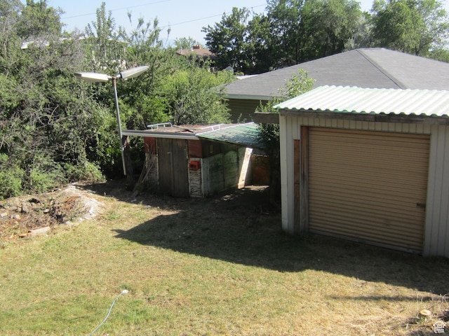 861 N 1100 E, Pleasant Grove, UT 84062 - view of grassy yard with an outdoor structure and a garage