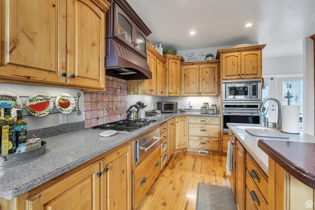 861 N 1100 E, Pleasant Grove, UT 84062 - kitchen with appliances with stainless steel finishes, a warming drawer, light wood finished floors, glass insert cabinets, and decorative backsplash