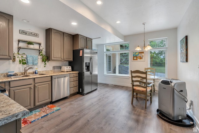 861 N 1100 E, Pleasant Grove, UT 84062 - kitchen with appliances with stainless steel finishes, a sink, wood finished floors, decorative light fixtures, and recessed lighting