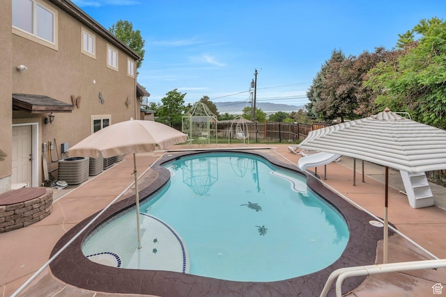 861 N 1100 E, Pleasant Grove, UT 84062 - view of pool featuring a water slide, a fenced backyard, a patio area, central air condition unit, and a gazebo