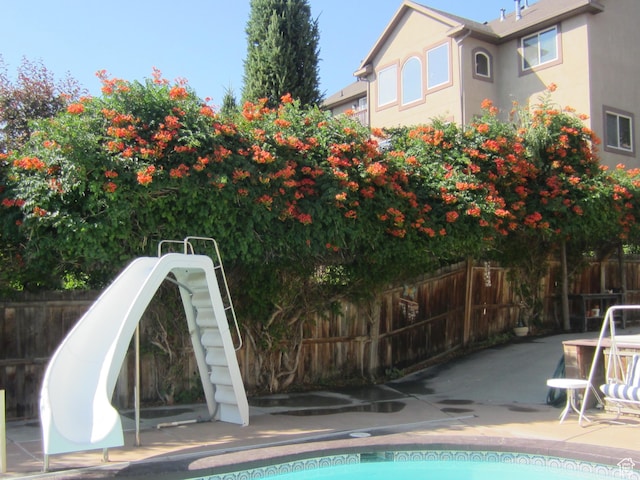 861 N 1100 E, Pleasant Grove, UT 84062 - view of swimming pool with a patio area and a water slide
