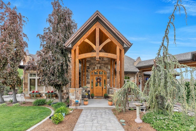 861 N 1100 E, Pleasant Grove, UT 84062 - doorway to property featuring stone siding and a lawn