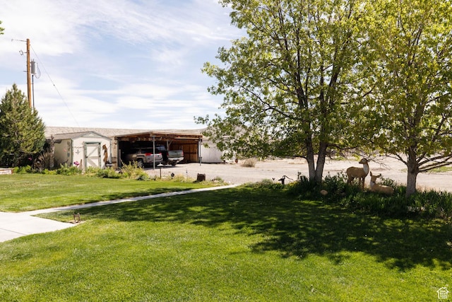 1090 N 200 E, Ferron, UT 84523 - view of grassy yard with an outbuilding and a carport