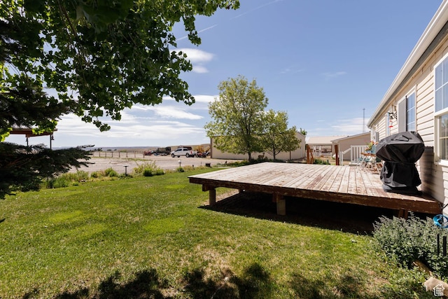 1090 N 200 E, Ferron, UT 84523 - view of green lawn featuring a wooden deck