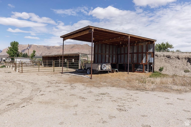 1090 N 200 E, Ferron, UT 84523 - view of outdoor structure with a mountain view, an outbuilding, an exterior structure, and a detached carport
